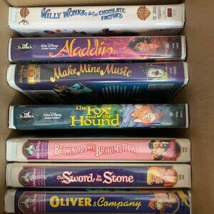 VHS Tapes, 6 Disney, 1 Warner Bros